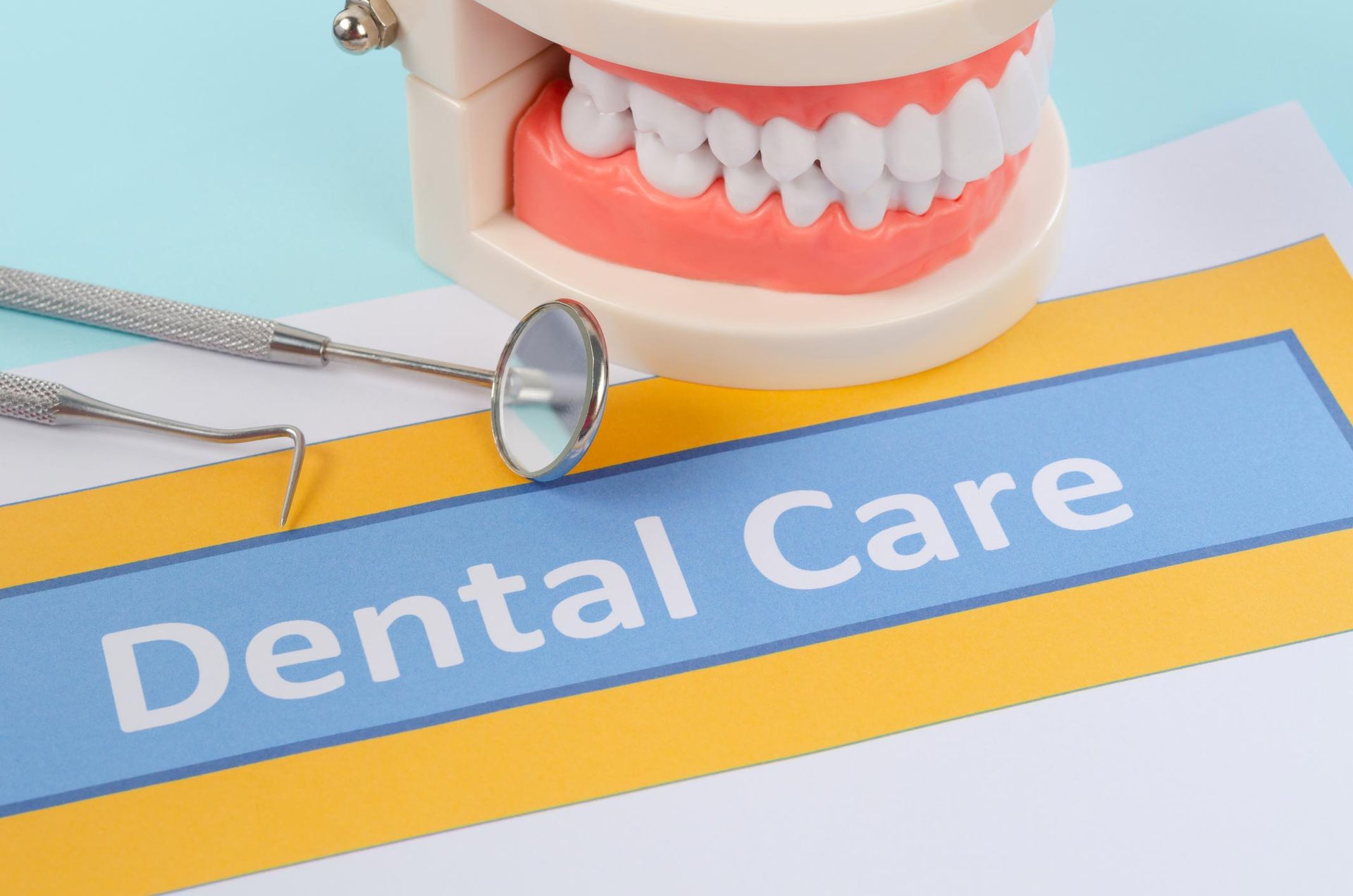 Set Of Metal Dentist's Medical Equipment Tools With Model Teeth In Clinic Over Blue Background — Beatrice, NE — Pinkerton Dentistry Set Of Metal Dentist's Medical Equipment Tools With Model Teeth In Clinic Over Blue Background — Beatrice, NE — Pinkerton Dentistry