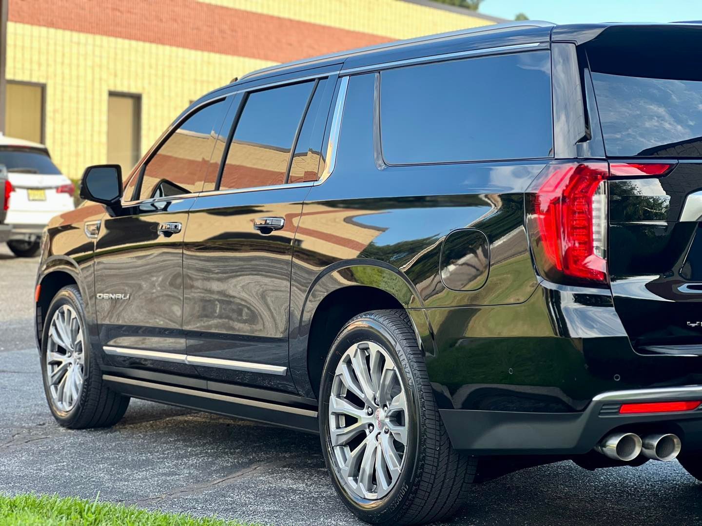 black vehicle parked outside with paint protection film