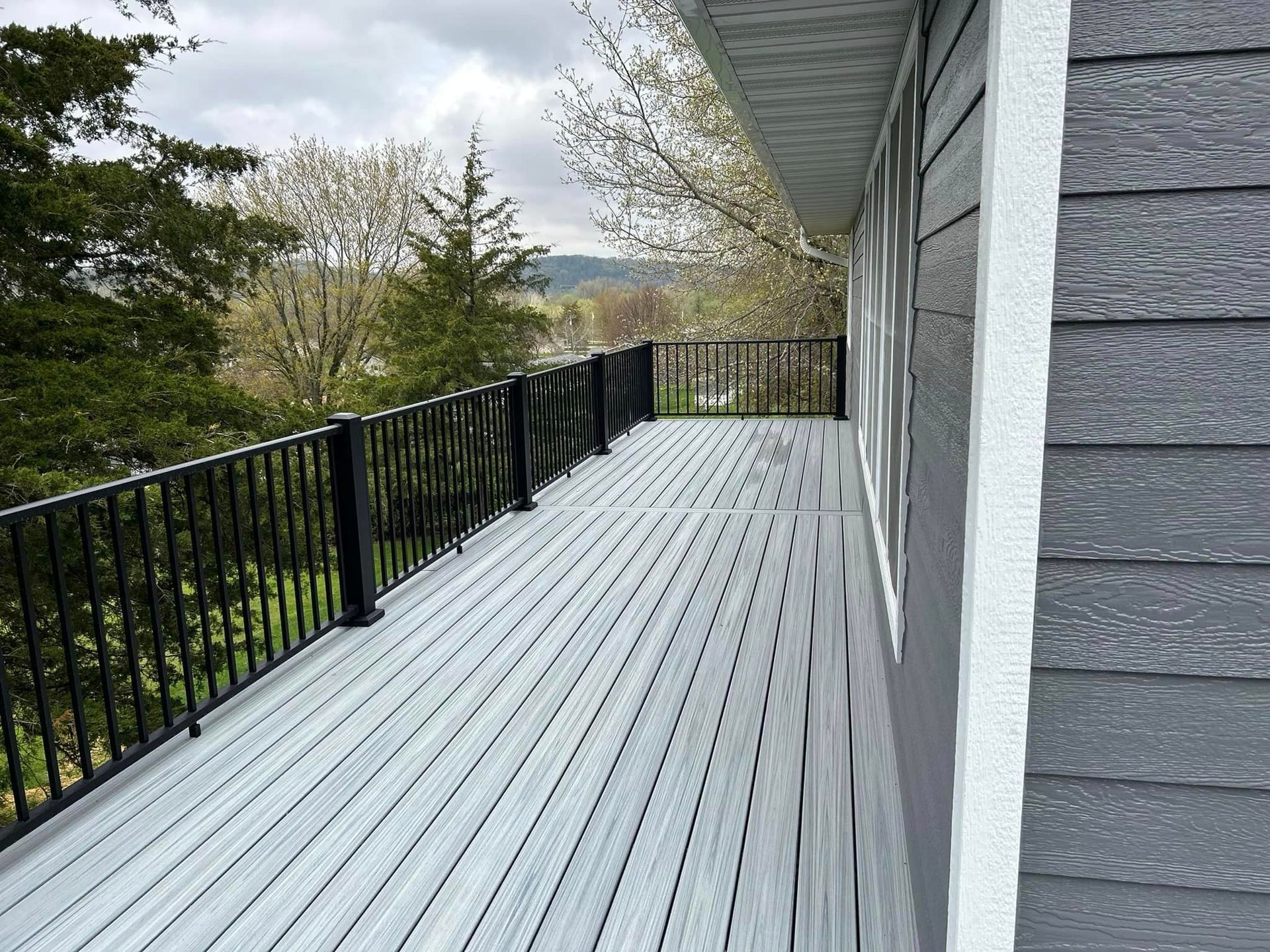Gray Wooden Deck – Decorah, IA – Viking Roofing & Construction
