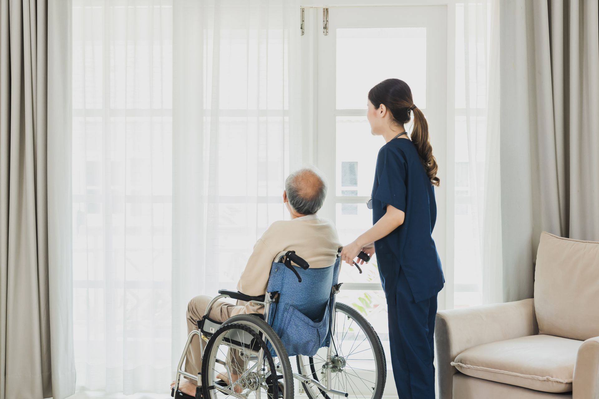 Care Remedy aide escorting an older adult to an outpatient procedure appointment in Massachusetts