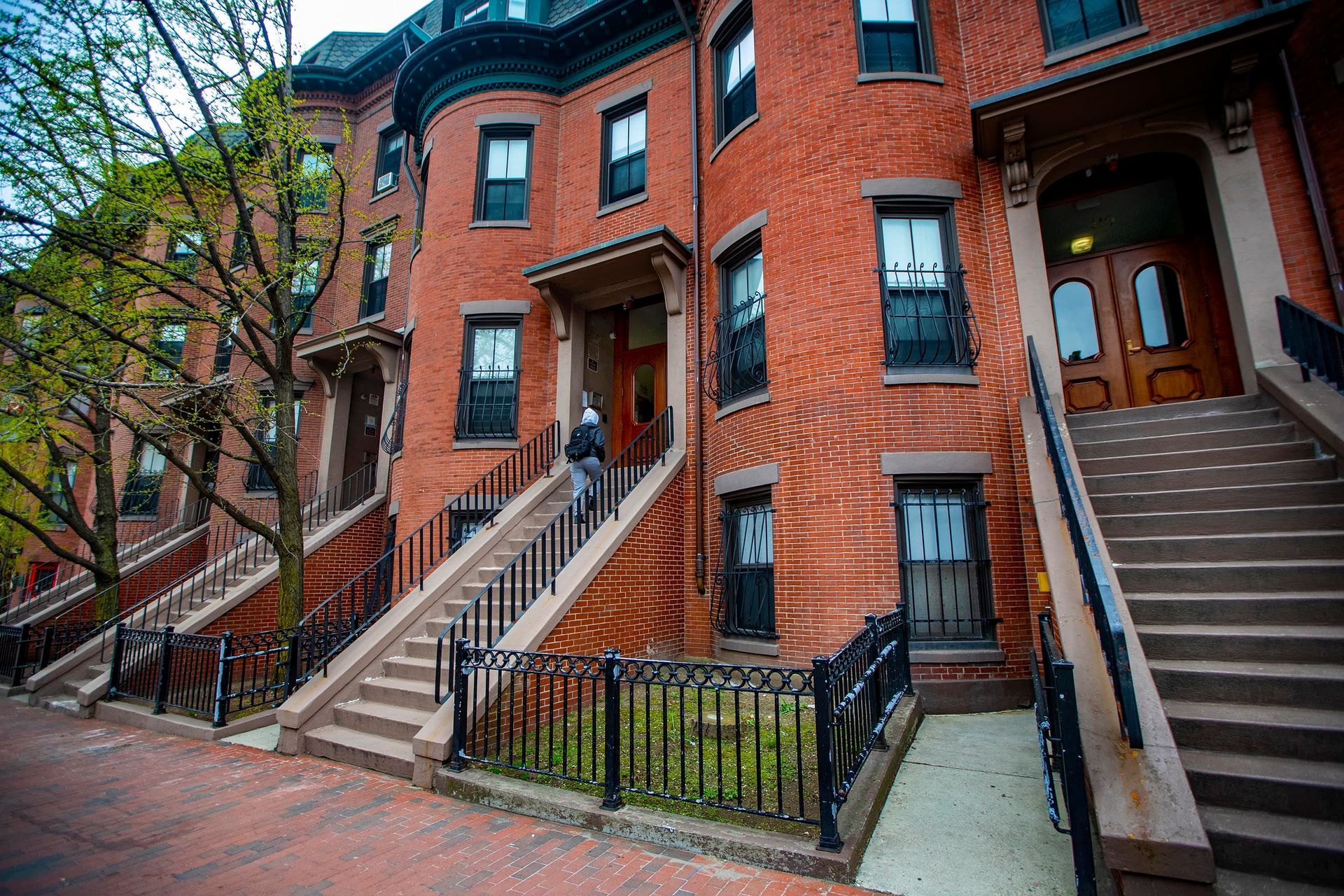 New England triple decker house with front stairs and porches