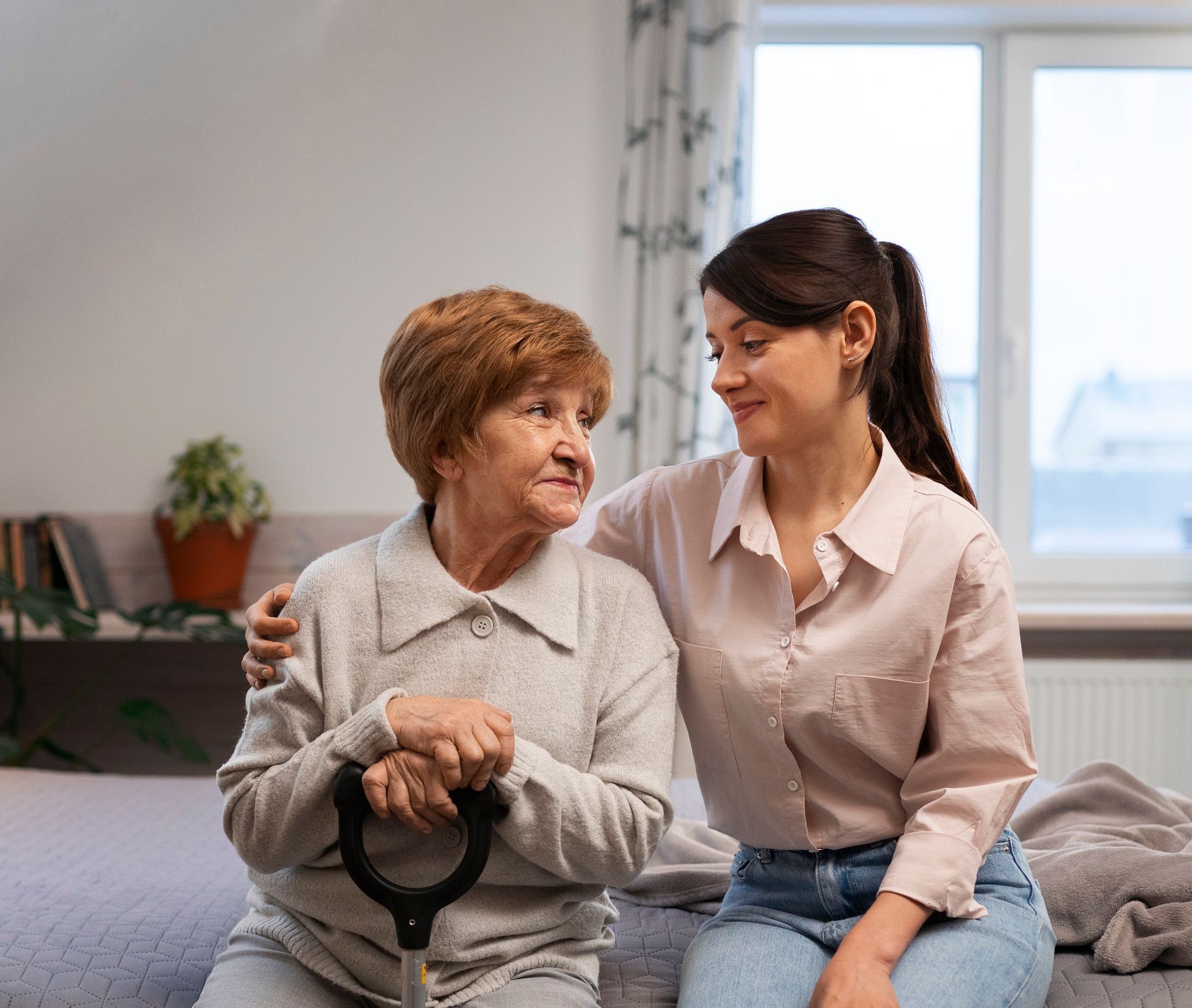 Care Remedy home health aide helping an older client at home in Cambridge MA