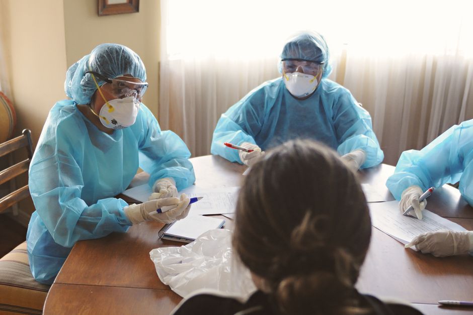Family interviewing a home care agency at the dining table