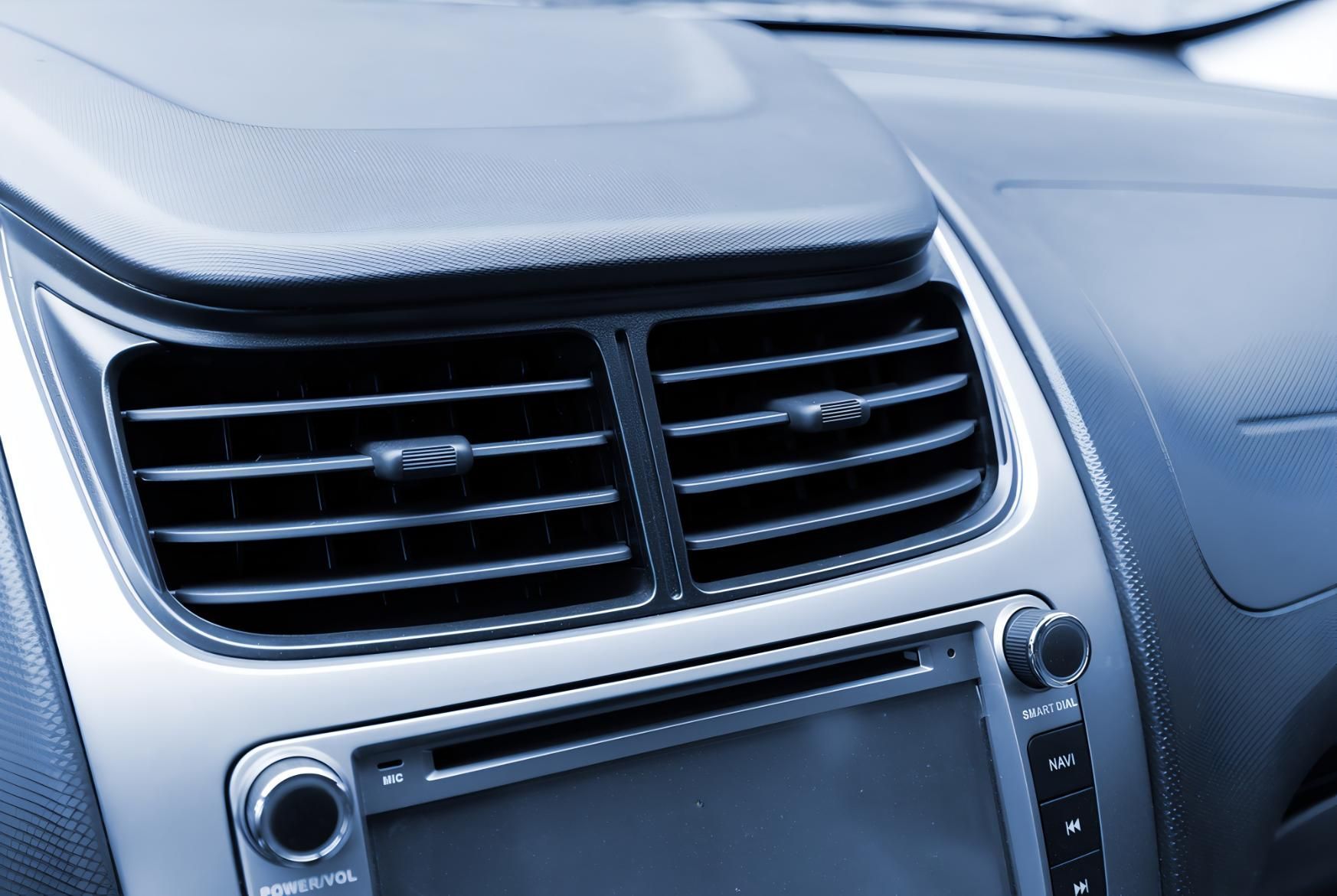 A Close Up of a Car Dashboard With Air Vents and a Radio — CWC Auto Services In Ainslie, ACT