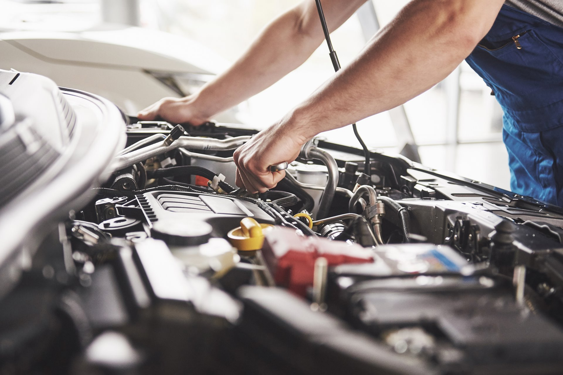 mechanic doing car maintenance