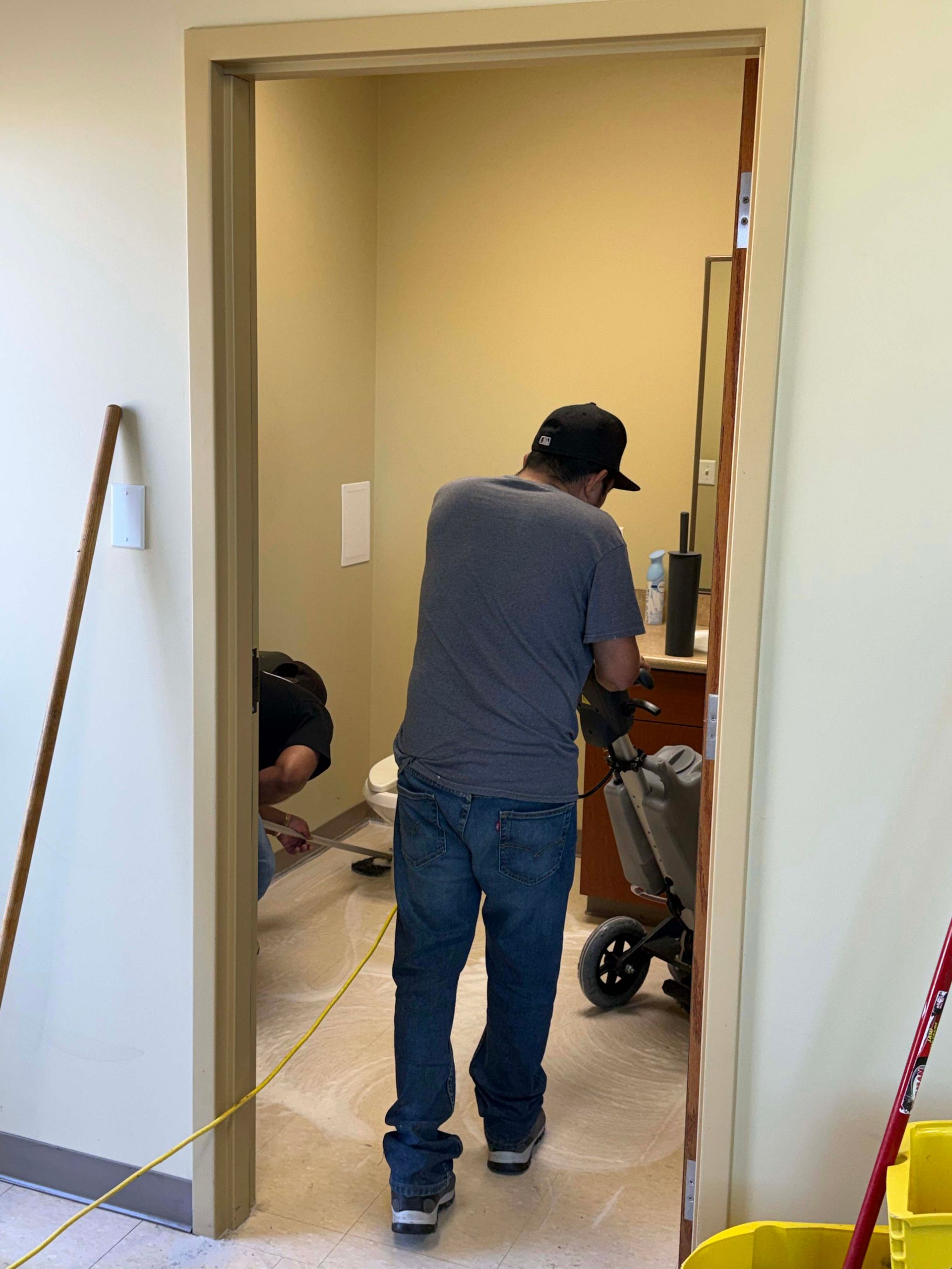 Mint crew member cleaning a commercial common area