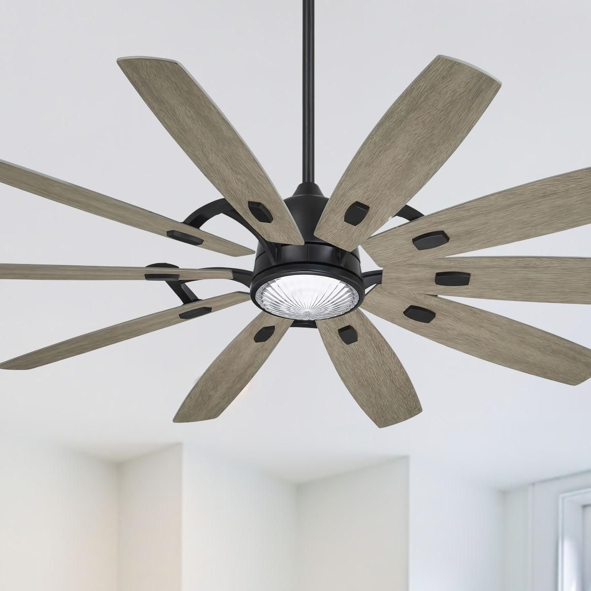 A ceiling fan is hanging from the ceiling in a room