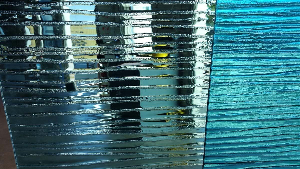 Textured glass panels in shades of blue and teal.