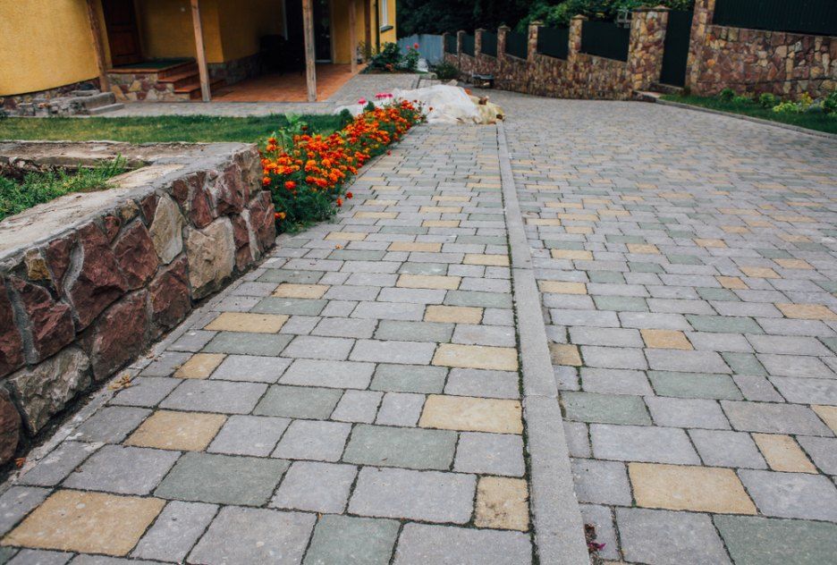 Red and Brown Brick Pavers Arranged in a Herringbone Pattern — Comet Concreting in Drayton, QLD