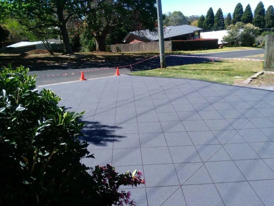 Dark Gray Tiled Driveway — Comet Concreting in Drayton, QLD