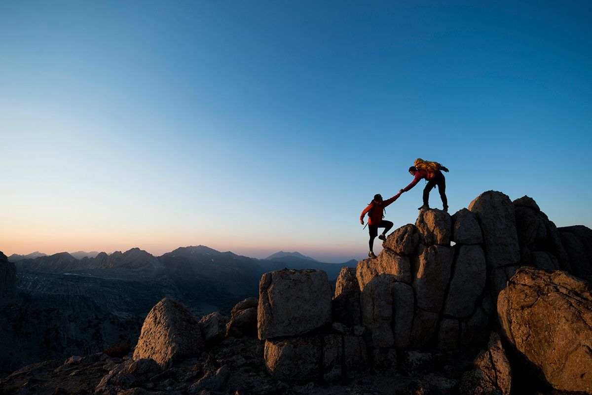 Two people mountain climbing