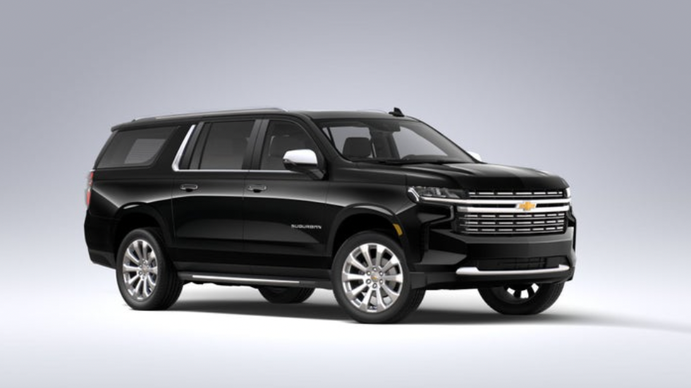 A black suv is parked on a white surface.