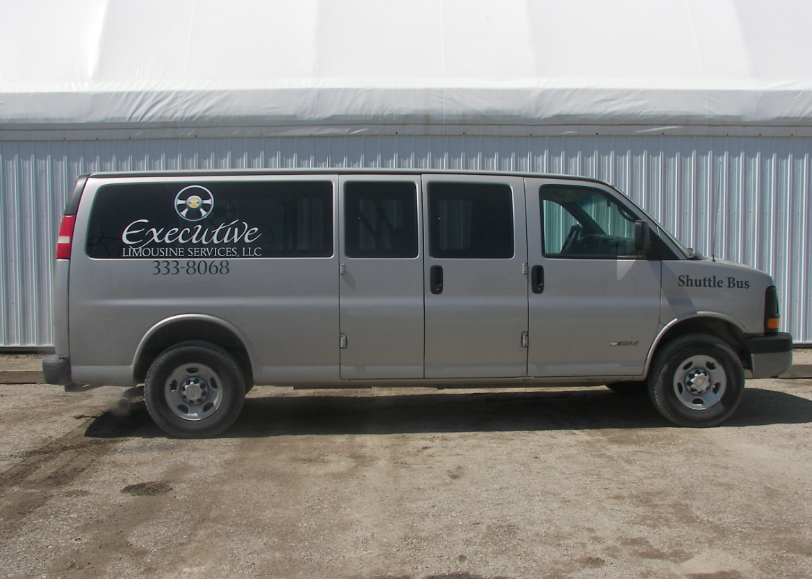 A silver van with the word executive on the side