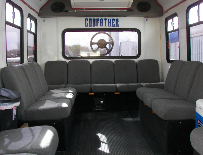 The inside of a bus with the word godfather on the wall