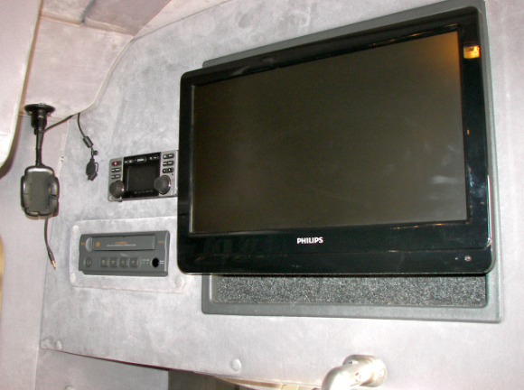 A philips television is mounted on a wall