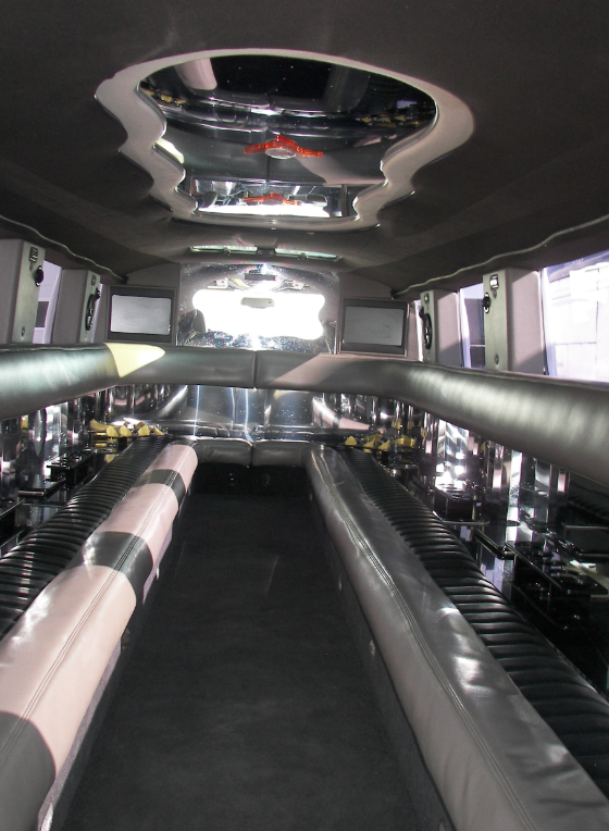 The inside of a limousine with a ceiling fan