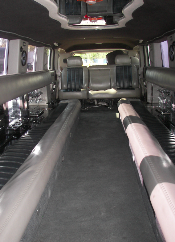 The inside of a limousine with a lot of seats