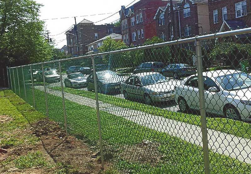 Chain Link Fence With Cars Parked — Clifton, NJ — All Jersey Fence Co.