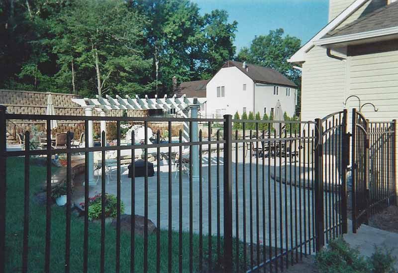 Wrought Iron Fence Surrounds a Swimming Pool — Clifton, NJ — All Jersey Fence Co.