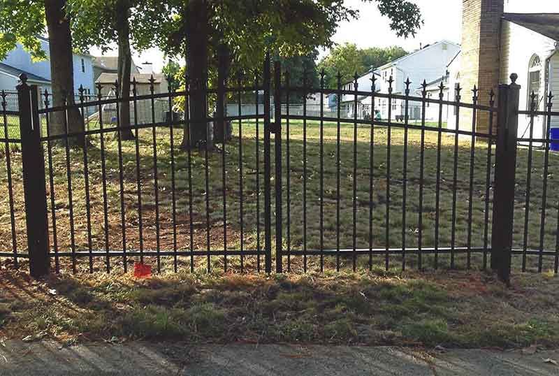 Wrought Iron Fence Surrounds a Lush Green Field — Clifton, NJ — All Jersey Fence Co.