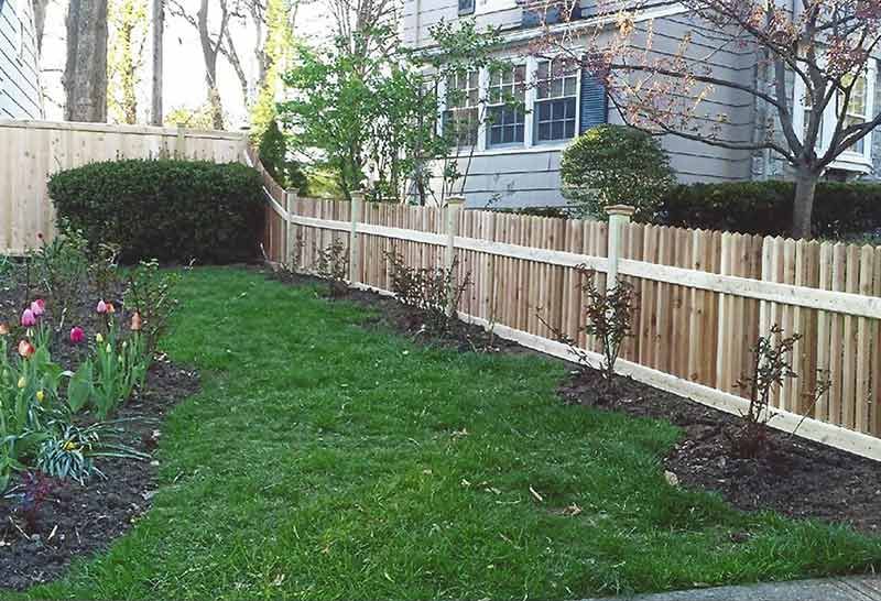 Wooden Fence Surrounds a Lush Green Yard — Clifton, NJ — All Jersey Fence Co.