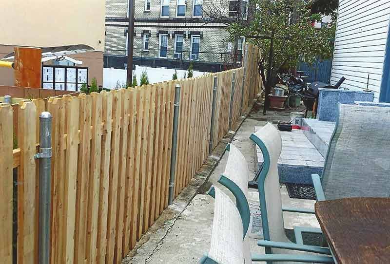 Wooden Fence Surrounds a Patio Area — Clifton, NJ — All Jersey Fence Co.