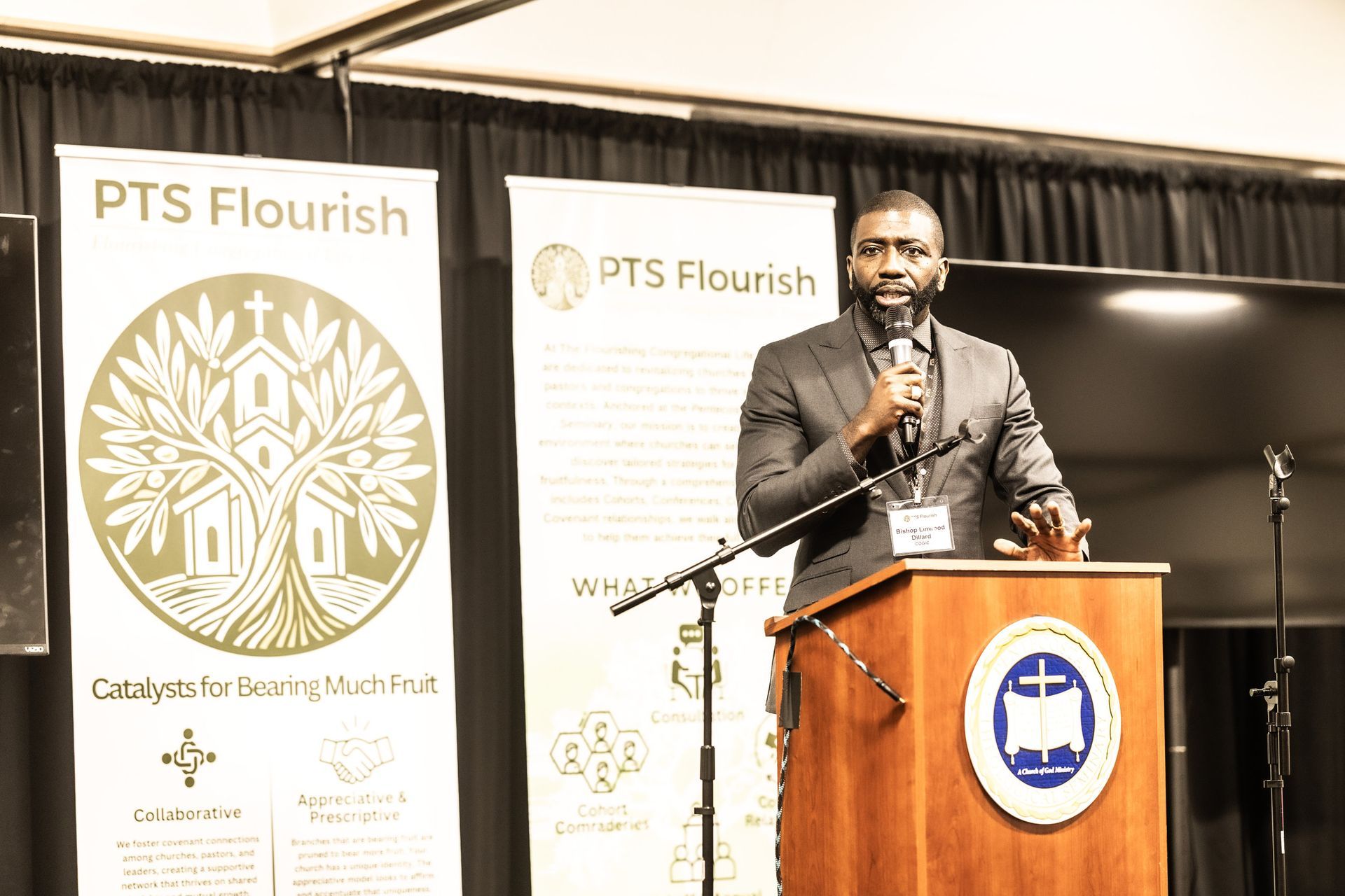 A man is standing at a podium giving a speech.