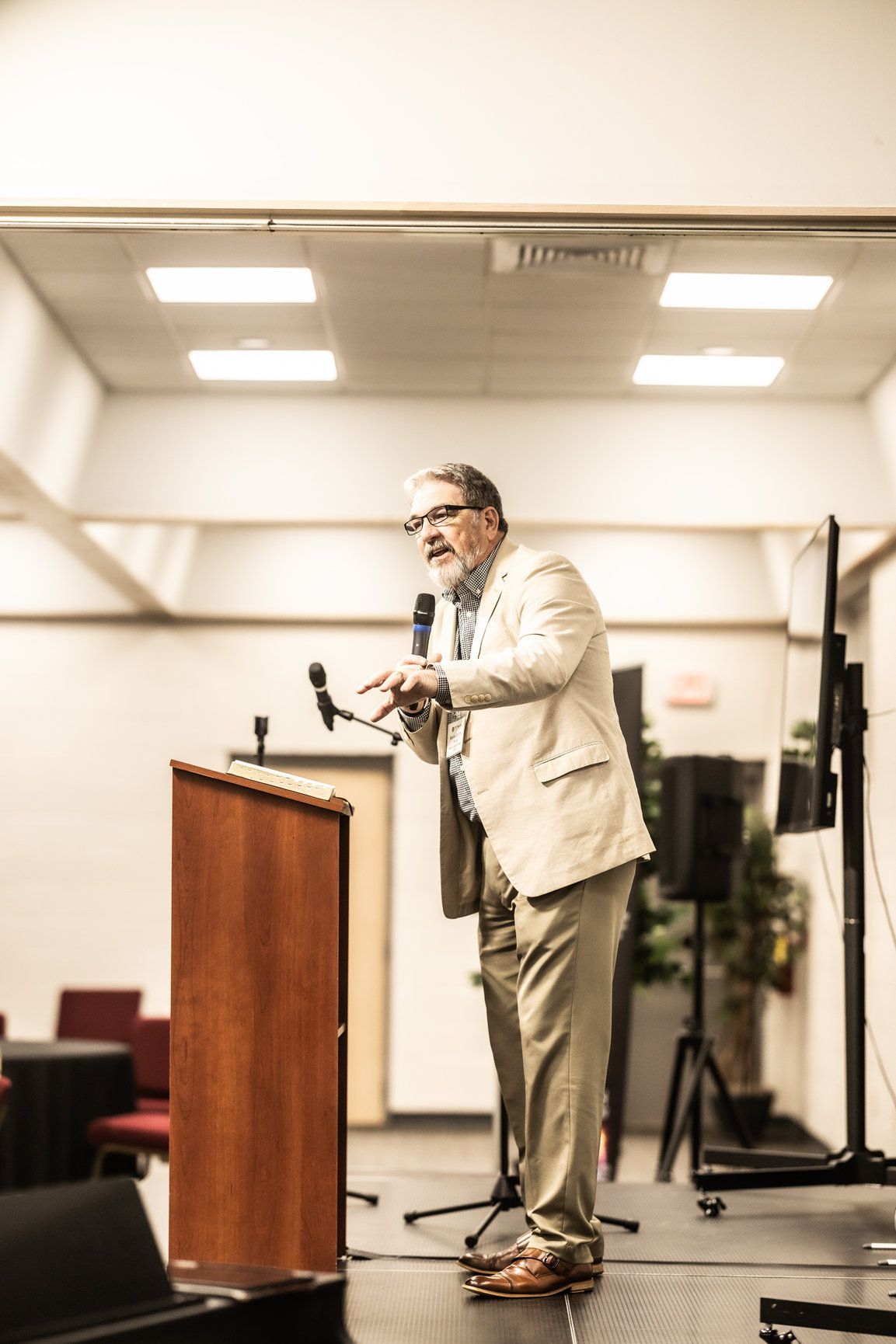 A man is standing at a podium giving a speech.