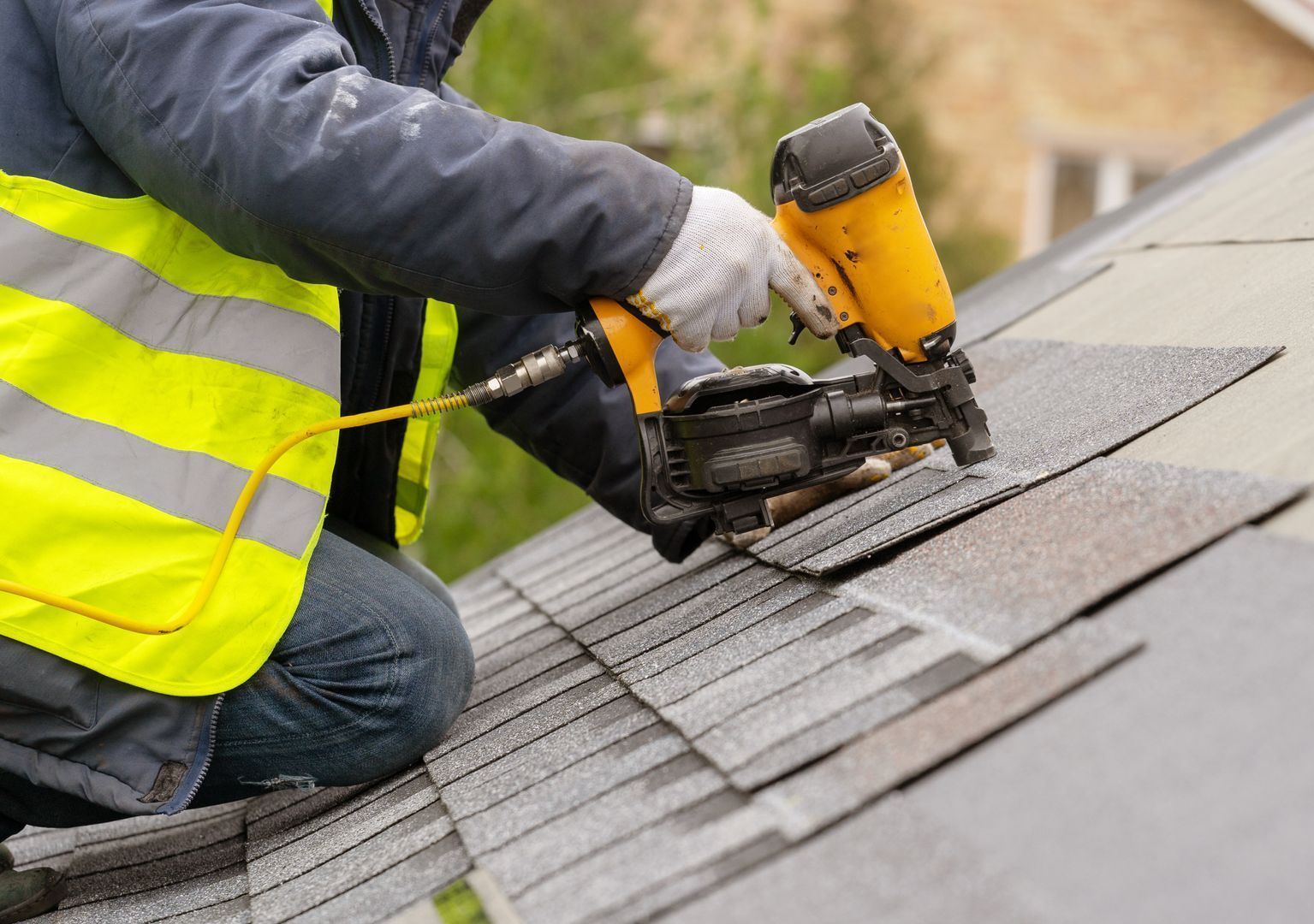 man repairing roof
