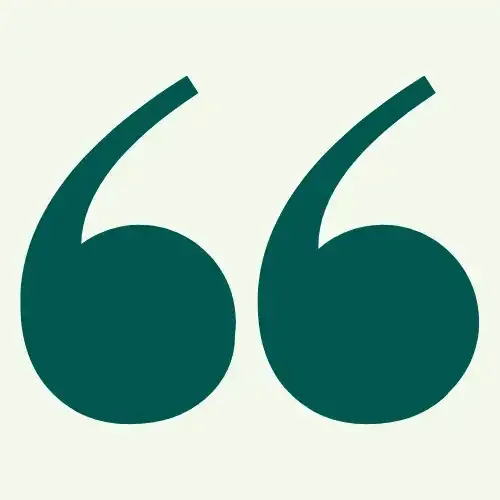 A green quote mark on a white background.