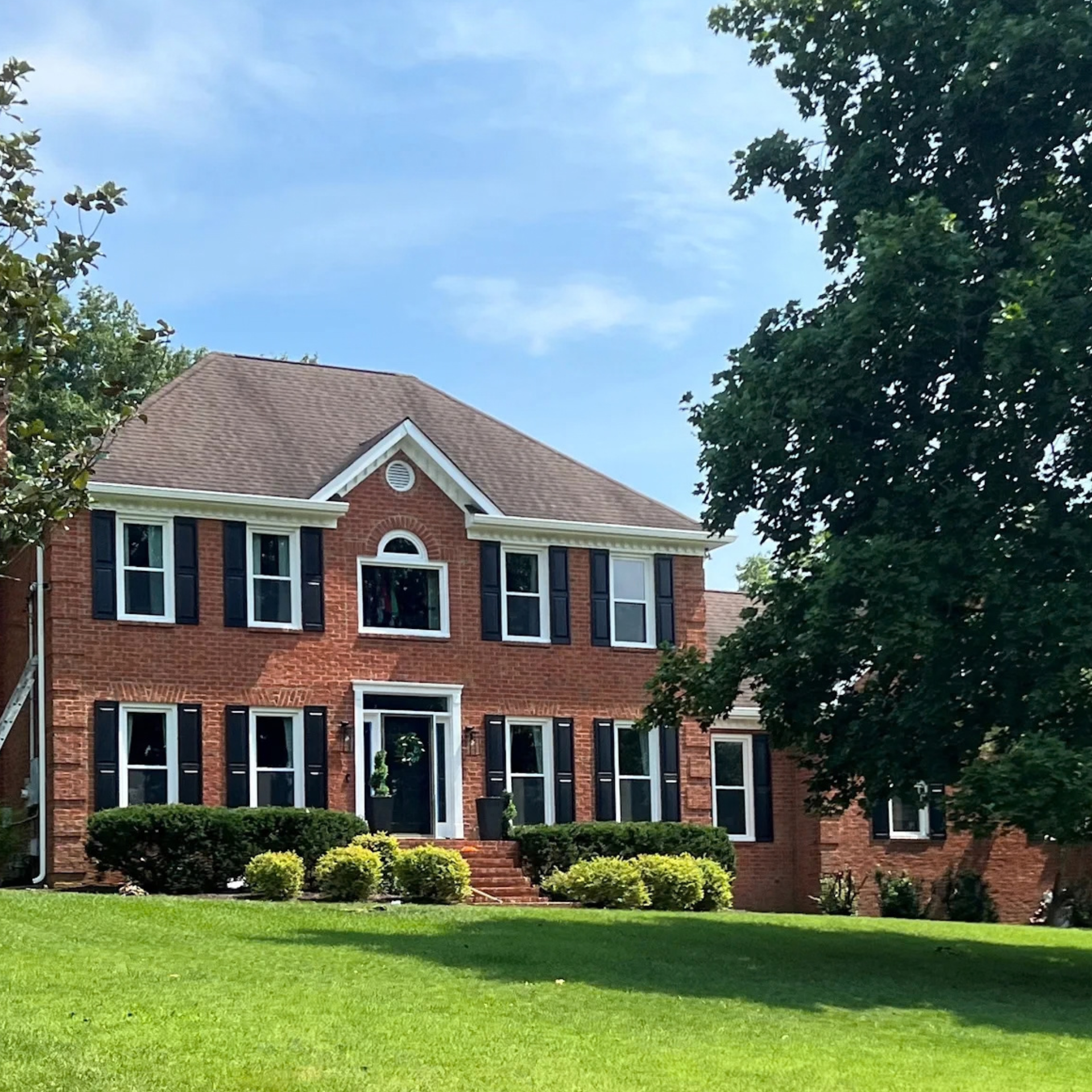 White double-hung replacement windows on residential home