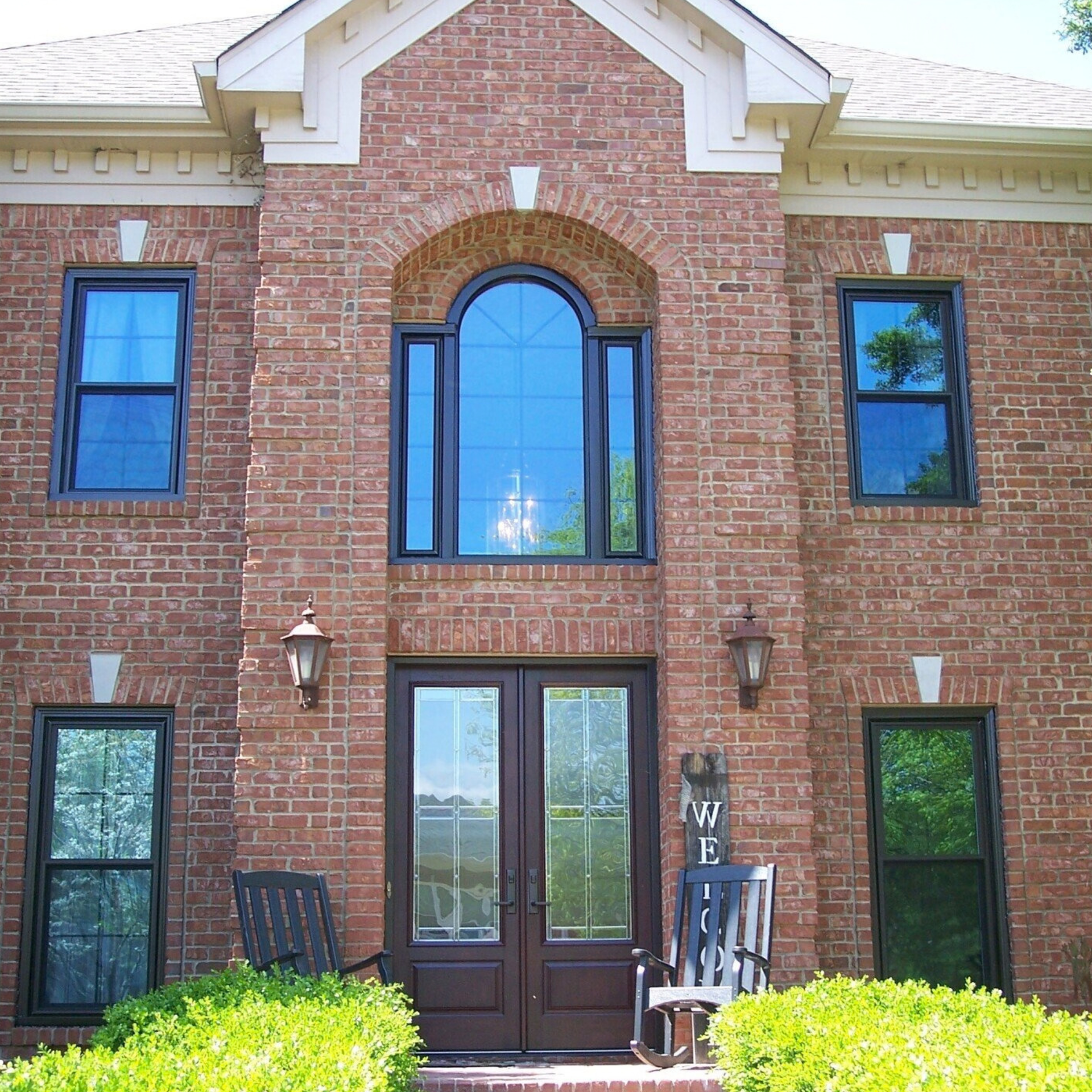 Modern replacement windows installed on traditional home