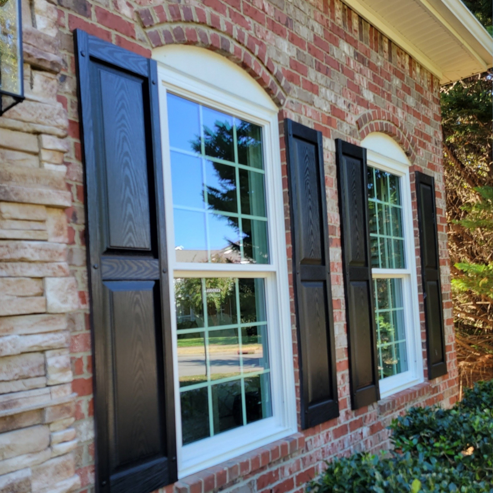 White double-hung replacement windows on residential home