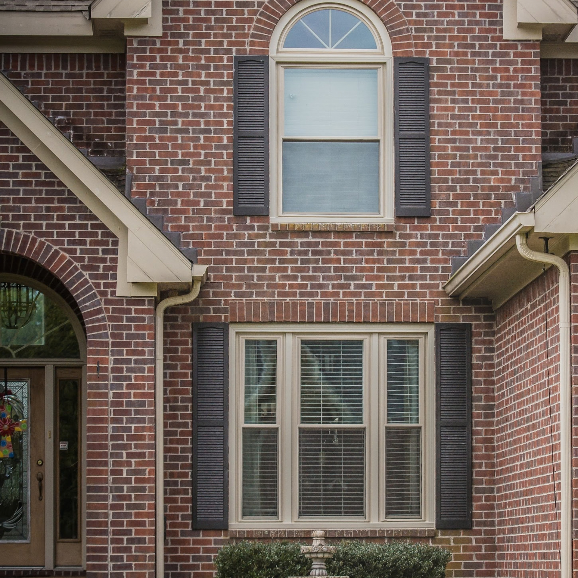 Newly installed replacement windows on a brick home
