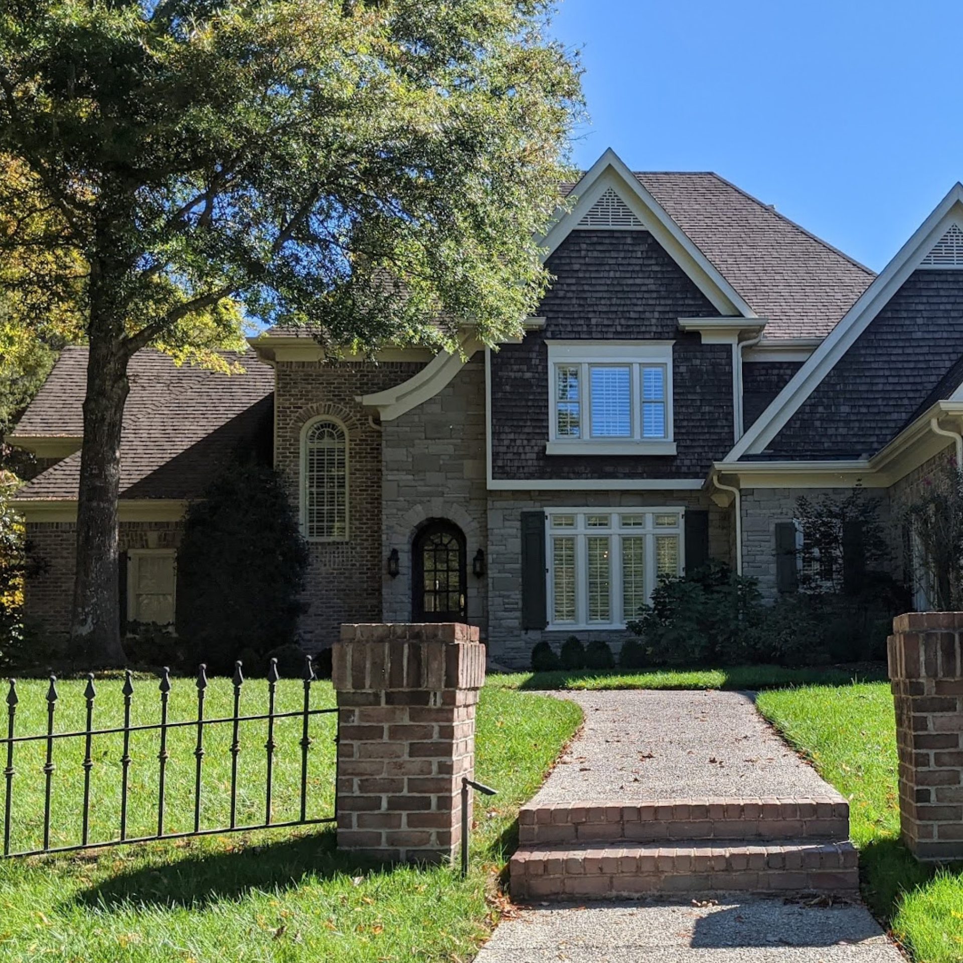 Newly installed replacement windows on a brick home