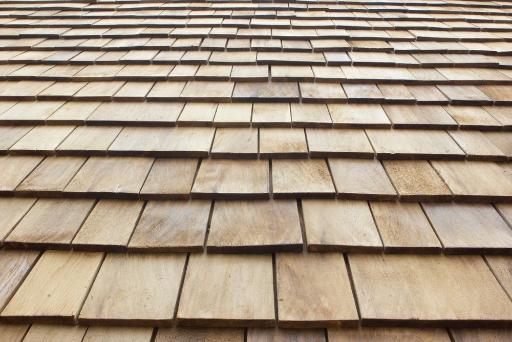 Wooden cedar shake roof tiles.