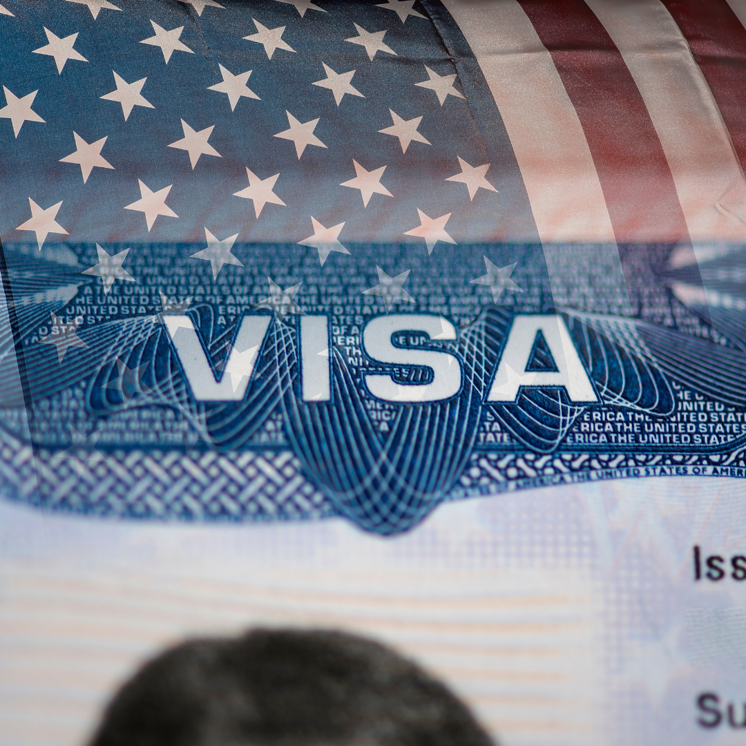 Foreign Professional working with Laptop in United States with Work Visa from Immigration Lawyer Orlando