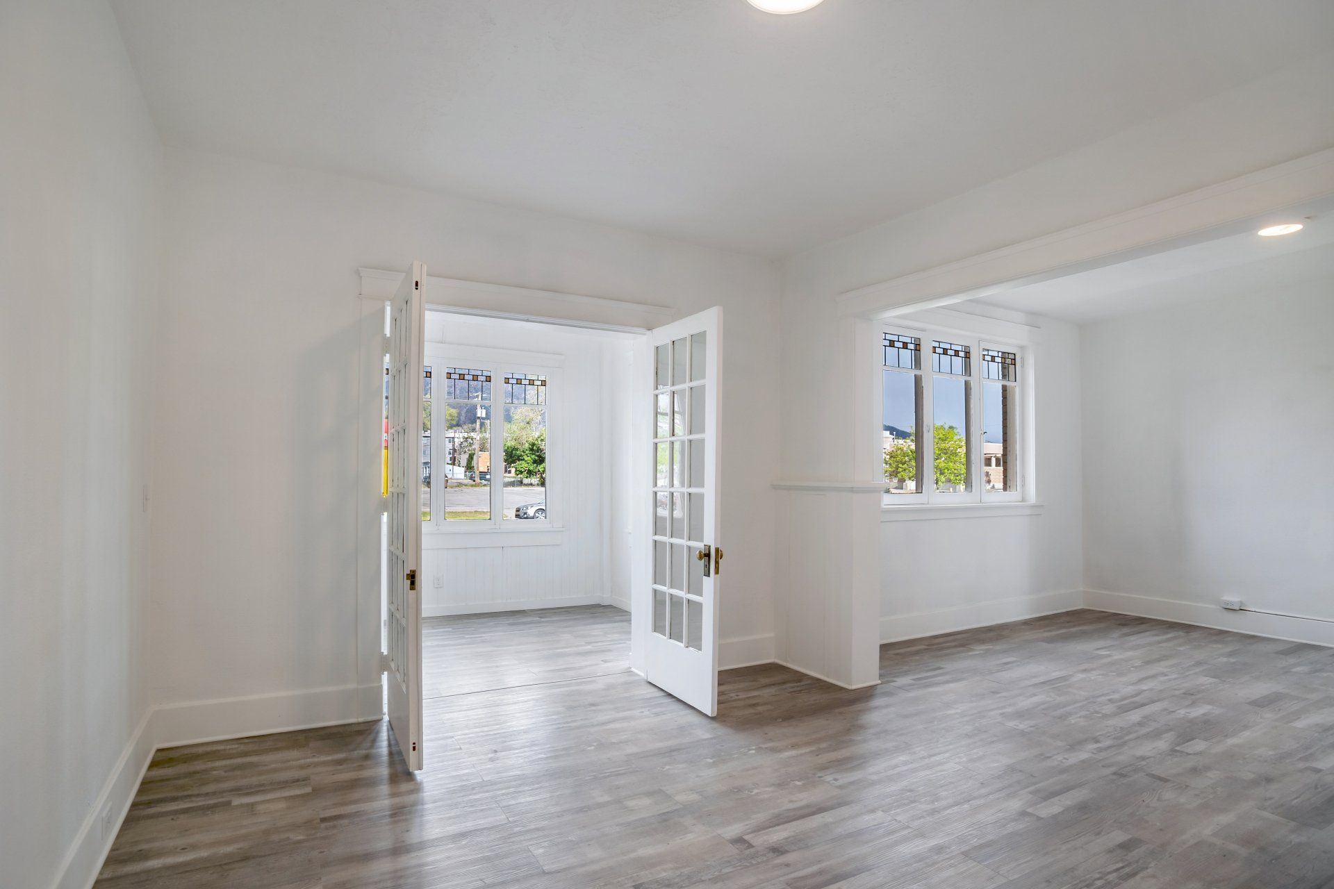 Living room with stainless glass and grey flooring
