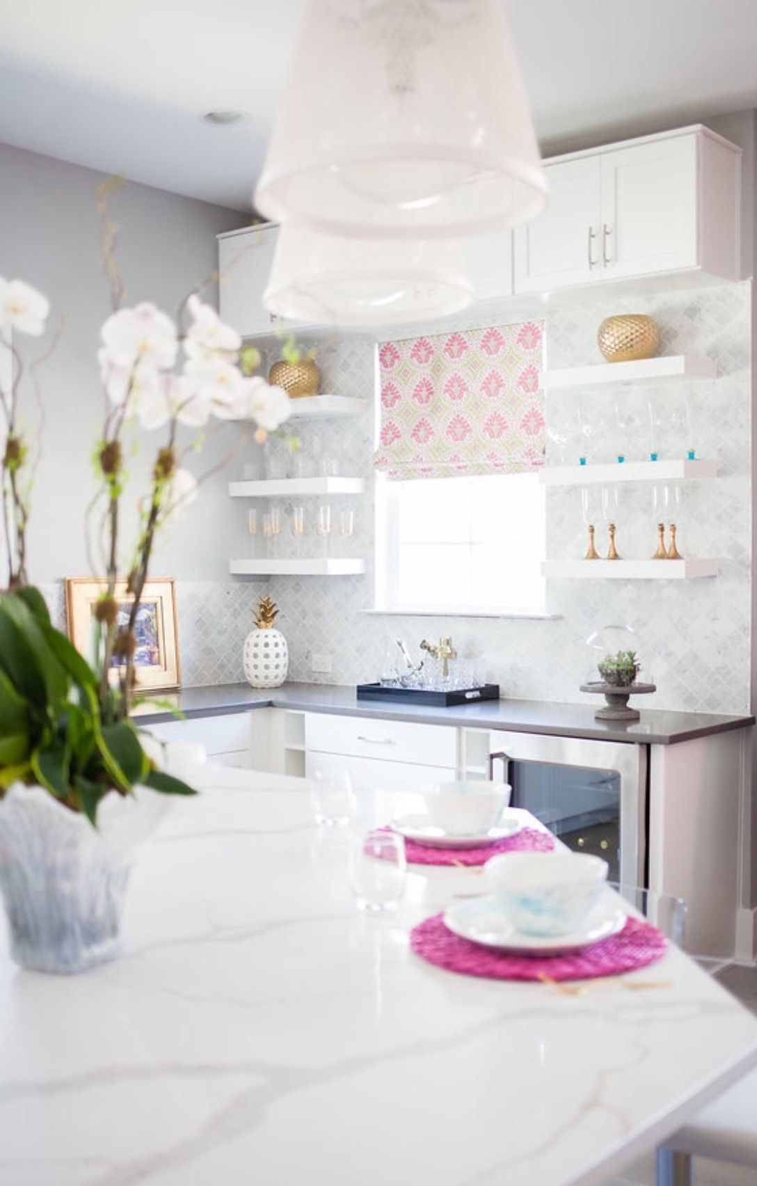 A kitchen with a table and plates on it.