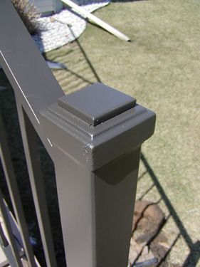 A close up of a black railing on a deck.