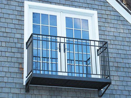 A balcony is attached to the side of a building