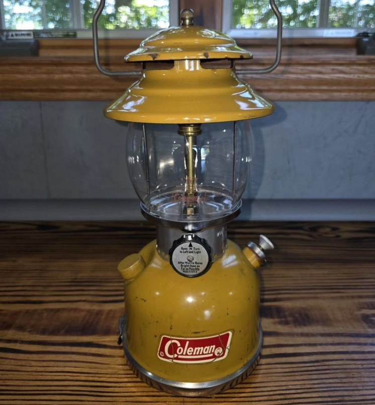 eBay listing for a vintage gold Coleman lantern with detailed product attributes