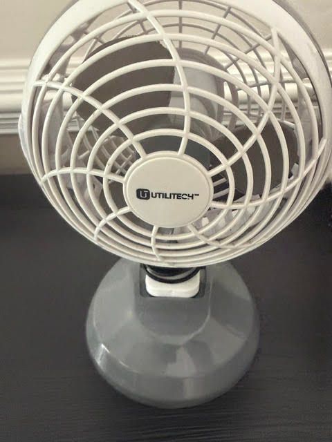Small single-speed desk fan representing a traditional one-keyword Google search