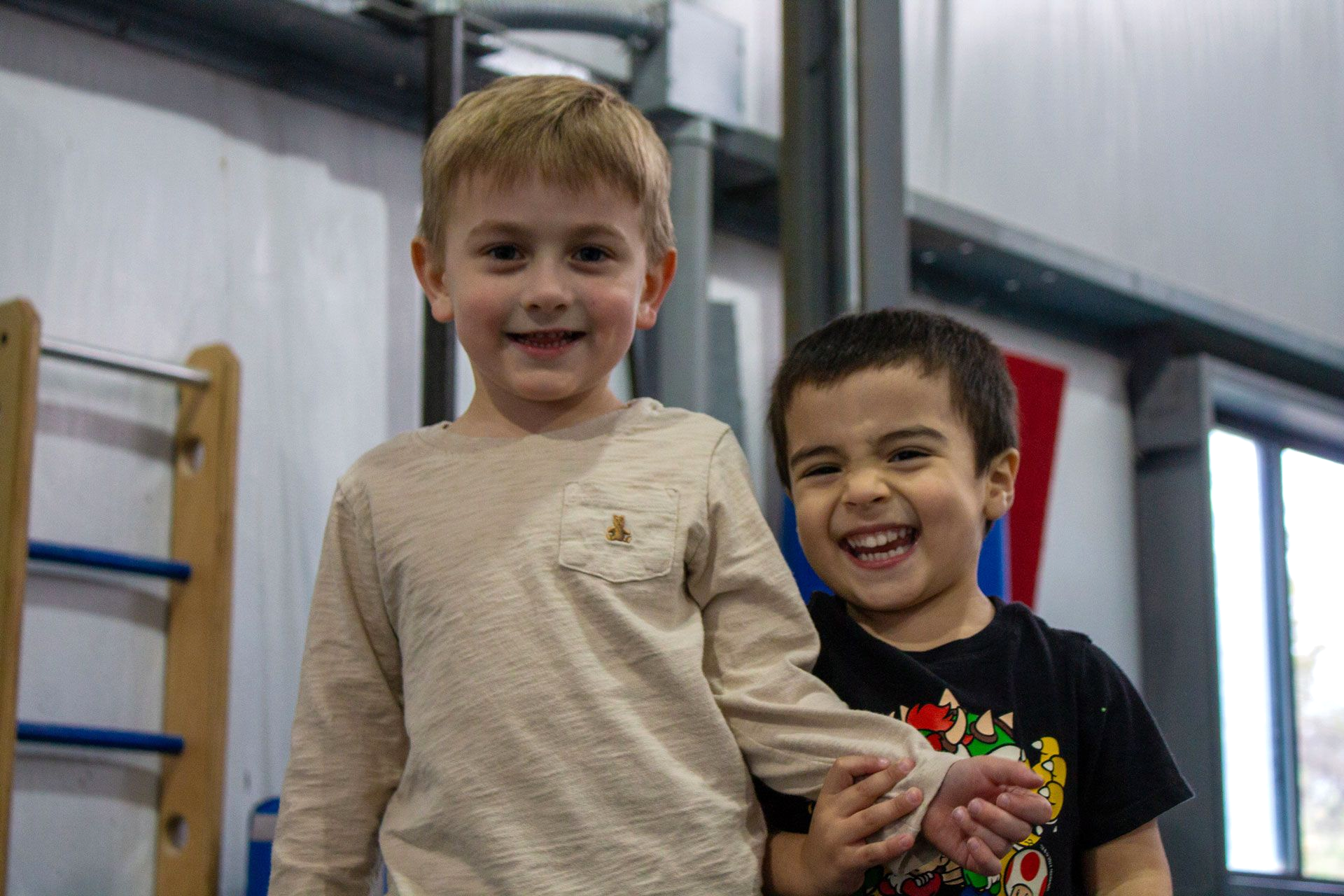 Two smiling young brothers at Paramount Gymnastics