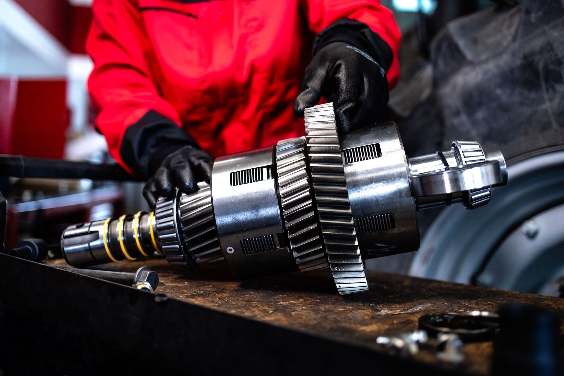 Mechanic repairing and servicing transmission for tractor agricultural machine. Mechanic repairing and servicing transmission for tractor agricultural machine.