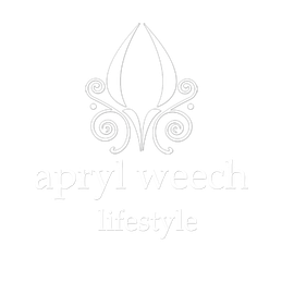 A black and white logo for ayurvedic lifestyle with a flower and swirls.