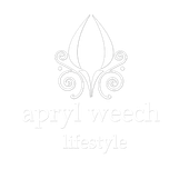 A black and white logo for ayurvedic lifestyle with a flower and swirls.