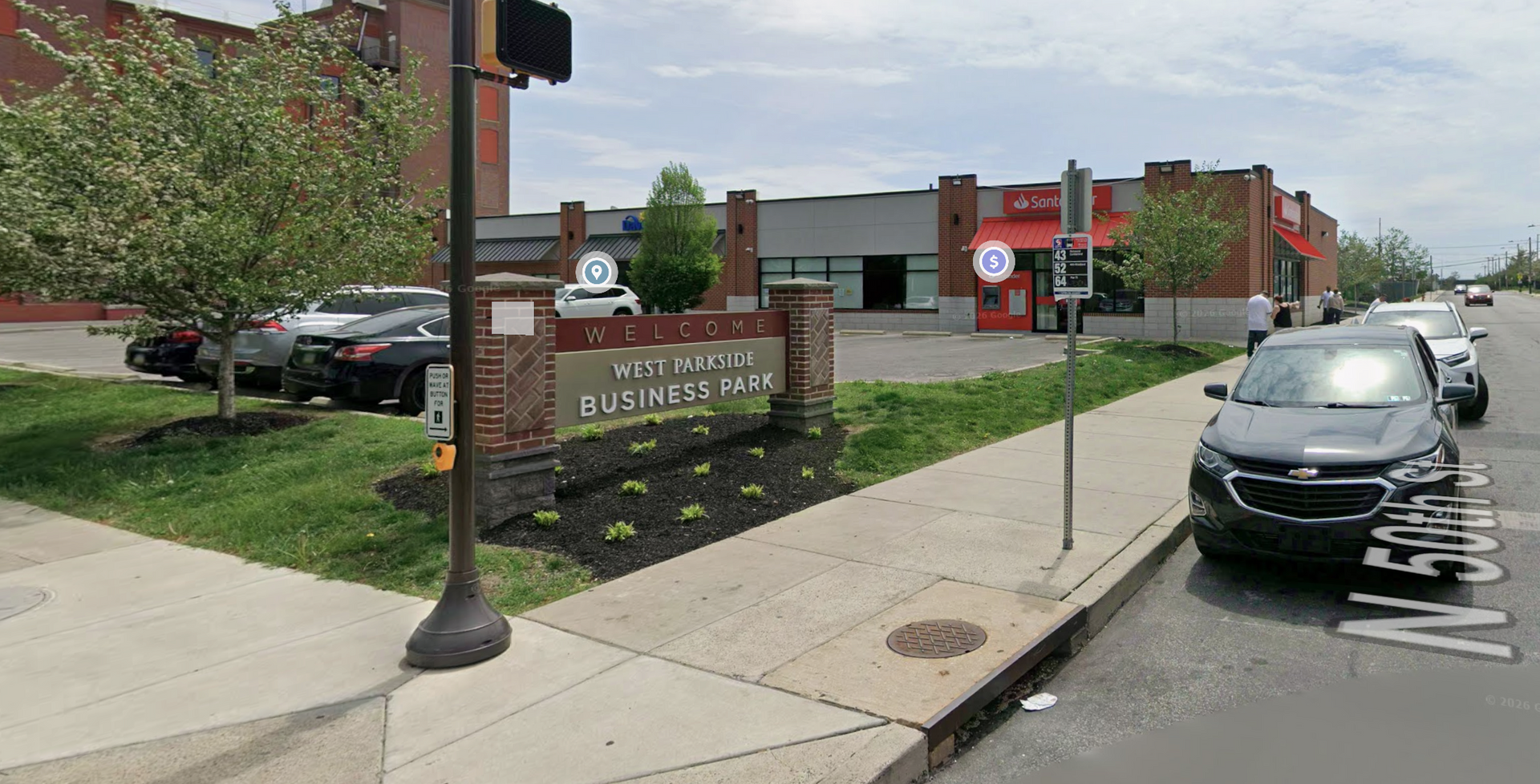 A brick sign reading 