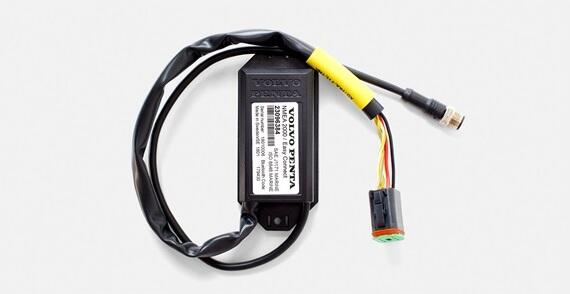A black Volvo Penta electronic interface module with wiring harnesses and a yellow-taped connector on a white background.