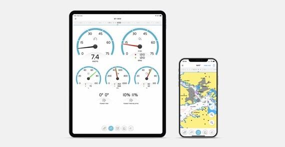 Tablet displaying marine instrument gauges next to a smartphone showing a nautical chart for navigation.